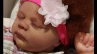 Box packing of realborn Jade asleep