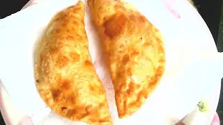 Chebureks with beef. Crispy fried flatbreads with juicy meat filling.