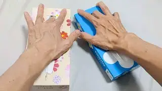 ASMR A hand and two tissue boxes