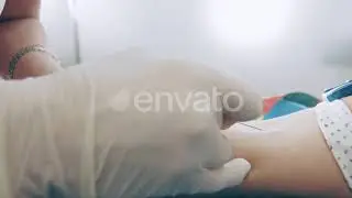 Nurse Pierces Hand with Needle Close Up. A Laboratory Worker Takes a Blood Sample for Antibodies...