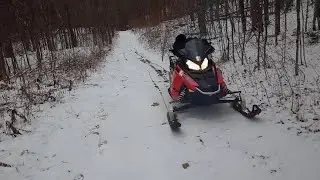 Trying to navigate around exposed road rocks due to lack of snow. Jan 6/24, AH, Ontario, Canada.