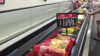 Picking up snacks on the escalator - Taiwan