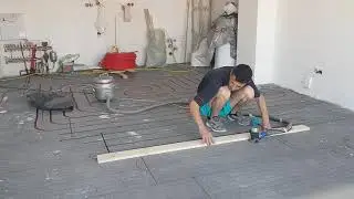 Cutting the channels with router in EPS insulation for no screed underfloor heating