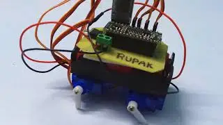 Four servo motors powered tiny quadruped robot without 3D printer