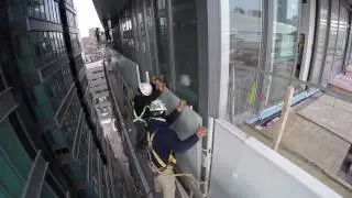 Railing glass installation on swing stage