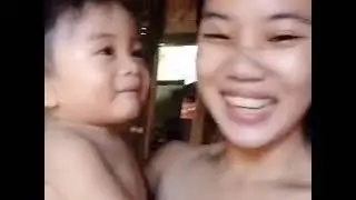 BONDING TIME.   TEENAGE MOM (16) WITH HER SON 