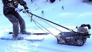 Tracked vehicle to tow a ski and snowboard - Backcountry Snowmobile