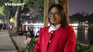People joyfully wait for the fireworks on New Year's Eve of the Lunar New Year