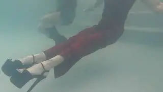 Preview of Mandi and Lexie swimming with clothes on.