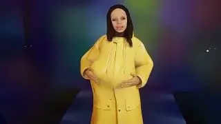 Young lady in yellow rubber jacket enjoys dancing movements with joy (rubber fetish)