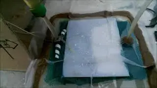 Resin infusion between two plates to get both sides glossy.