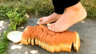 Crushing & stomping on bread loaf with bare dirty feet