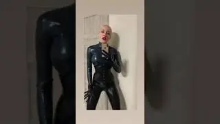 Totally latex look: latex leggings, latex corset, latex top and latex gloves.