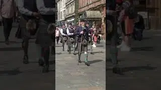 Perth Pipe Band playing Scotland the Brave leading the 2023 Mela Parade through the City 