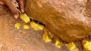 Finding and digging treasure gold under stone at mountain