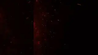 4k fire embers fire Particles sparks over black background, Fire flames particles swirls in the air.