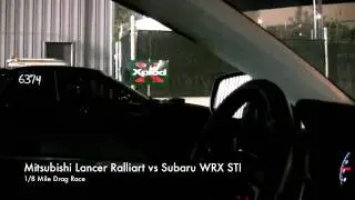 2009 Mitsubish Lancer Ralliart vs Subaru WRX STI 1/8 Mile Drag Race.mp4