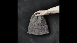 A cool knitted hat. Quick and easy to knit. Melange yarn.