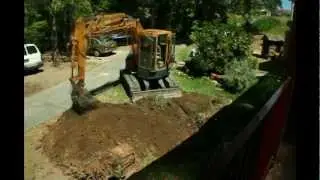 Excavator Removing Tree Stump, Time Lapse