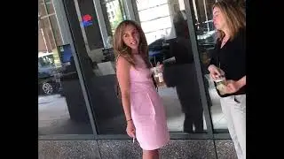 Mature businesswoman chain smokes on the street