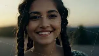 Young woman smiling outdoors with braids in hair