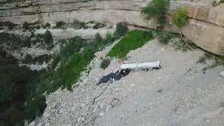 Truckload of tar over the cliff near the tunnel on highway 82