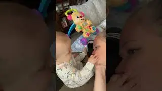 Playful Infant Accidentally Makes Sudden Gesture and Slaps Parent