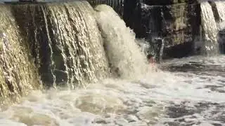 Под водопадом.
