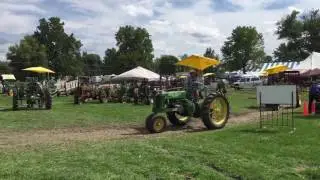 Vika driving John Deeres at the Thrashers Reunion