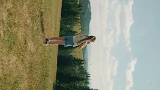 Young girl photographer changing camera settings