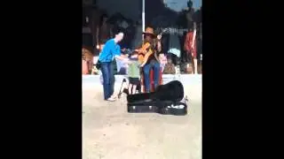 An 8 year old blind, autistic boy came across a street performer