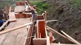 Veterans concrete,...pre pour walk through / ret. wall formwork & ironwork