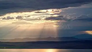 8K Stock Video - Sun rays shining through the clouds during timelapse in Utah