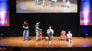 Merlin_Spain giving Merlin's cast a fanbook during Q&A 13/07/2014 (WizardCon)w