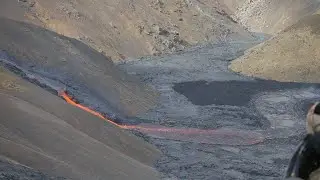 Lava flows into Meradalir from a hole on side of the crater of Fagradalsfjall 10 July 2021- Iceland