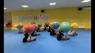 Aerobic gymnastics team performs DNS warm-up