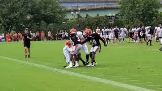 Tee Higgins collides with Nick Scott and Cam Taylor-Britt in Bengals practice Monday