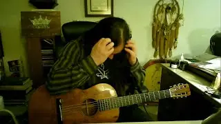 Sunny White playing a 104 year old Martin guitar (courtesy of LAWSON Guitars).