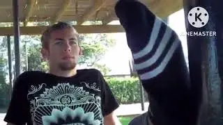 XB - Jake rests feet on a pole