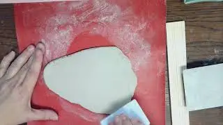 smoothing a clay slab