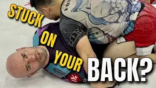Getting unstuck from the bottom in half guard