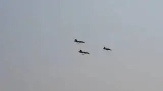 Two Gripens and a Hawk performing a low level flyby