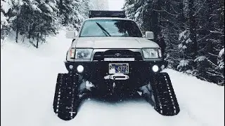 Snow wheeling on tracks and dragging a wrangler on 37