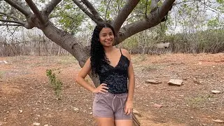 Angelina showing the roots of the seriguela and imbu trees.