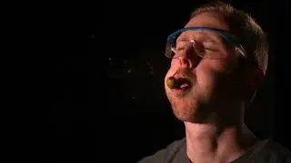 Man Spits Olive at Another Mans Face