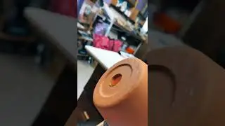 Loading a terracotta pot with glass