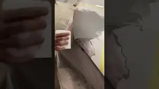 Applying gray putty on hood nicely 