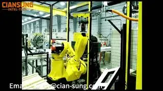 Industrial robots carry glass frames for automated gluing applications.