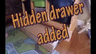 Added a base and a hidden drawer to an existing toy storage
