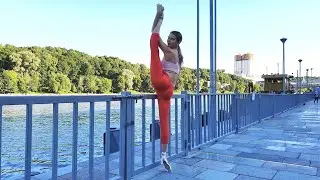 Ballet on the street. Flexible ballerina Viktoria walks on pointe and does splits.